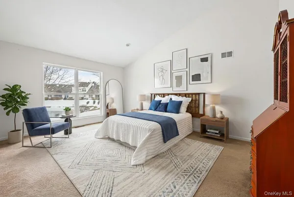 a bedroom with a bed and window