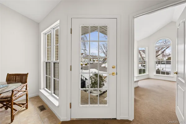 wooden floor in a room with windows