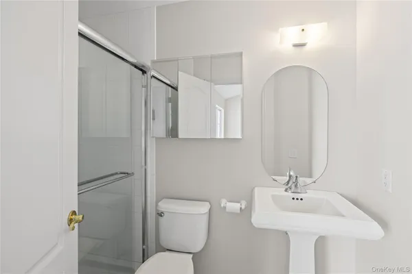 a kitchen that has a sink and a refrigerator
