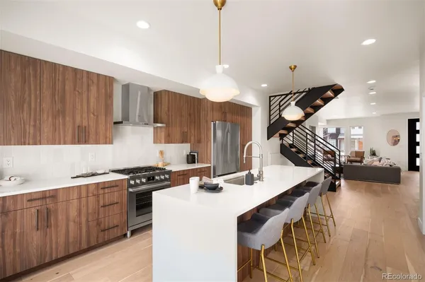 a kitchen with a table chairs stove and cabinets