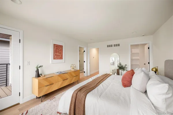 a bedroom with double bed and a window