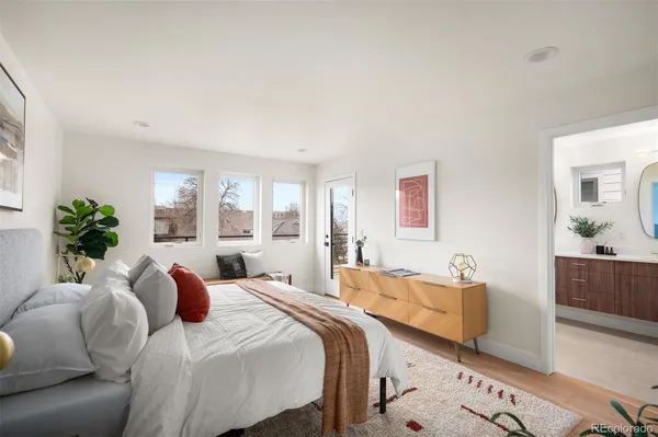 a bedroom with 2 bed and a couch