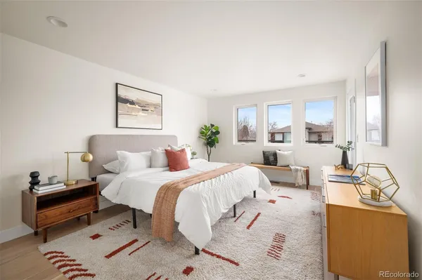 a bedroom with a bed and a couch