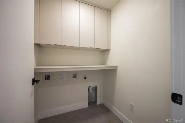a view of storage and utility room with washer and dryer