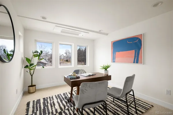 a view of a dining room with furniture