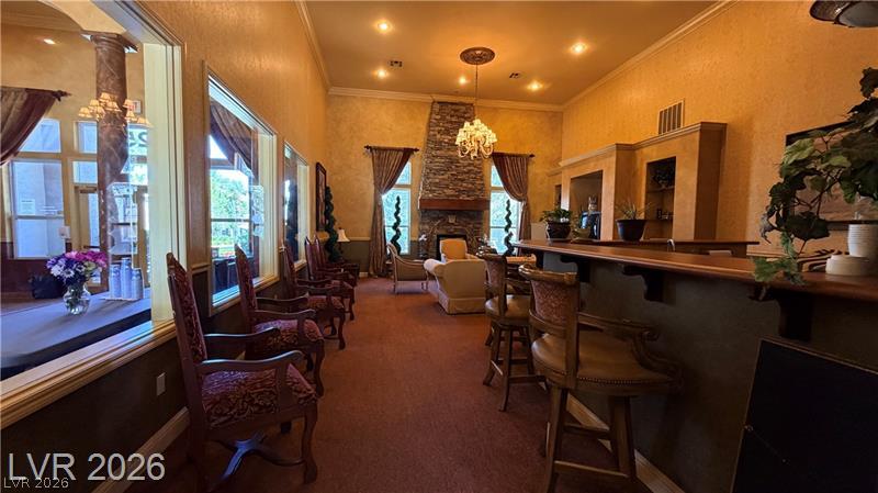 7255 West Sunset Road, Unit 2027 Las Vegas, NV 89113 - Photo 31 of 38 High ceilings and a stone fireplace create a grand setting in this spacious room.