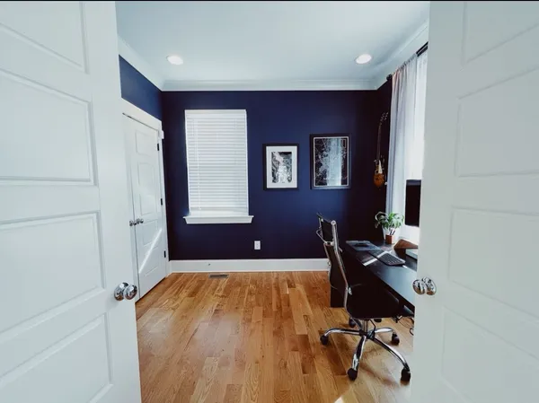 a room with furniture and wooden floor