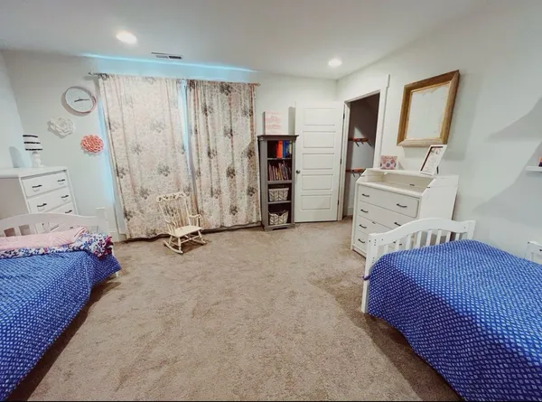 a bedroom with a bed and a walk in closet