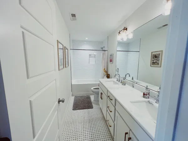 a bathroom with a sink a mirror and a shower