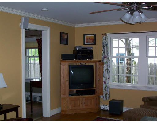 33 Pine Ridge Road Wellesley, MA 02481 - Photo 16 of 27 a living room with furniture a flat screen tv and a fireplace