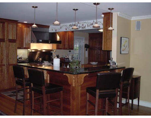 33 Pine Ridge Road Wellesley, MA 02481 - Photo 18 of 27 a kitchen with a table and chairs