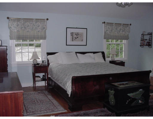 33 Pine Ridge Road Wellesley, MA 02481 - Photo 9 of 27 a bed sitting in a bedroom next to a window