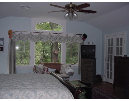 33 Pine Ridge Road Wellesley, MA 02481 - Photo 10 of 27 a bedroom with a bed and a window