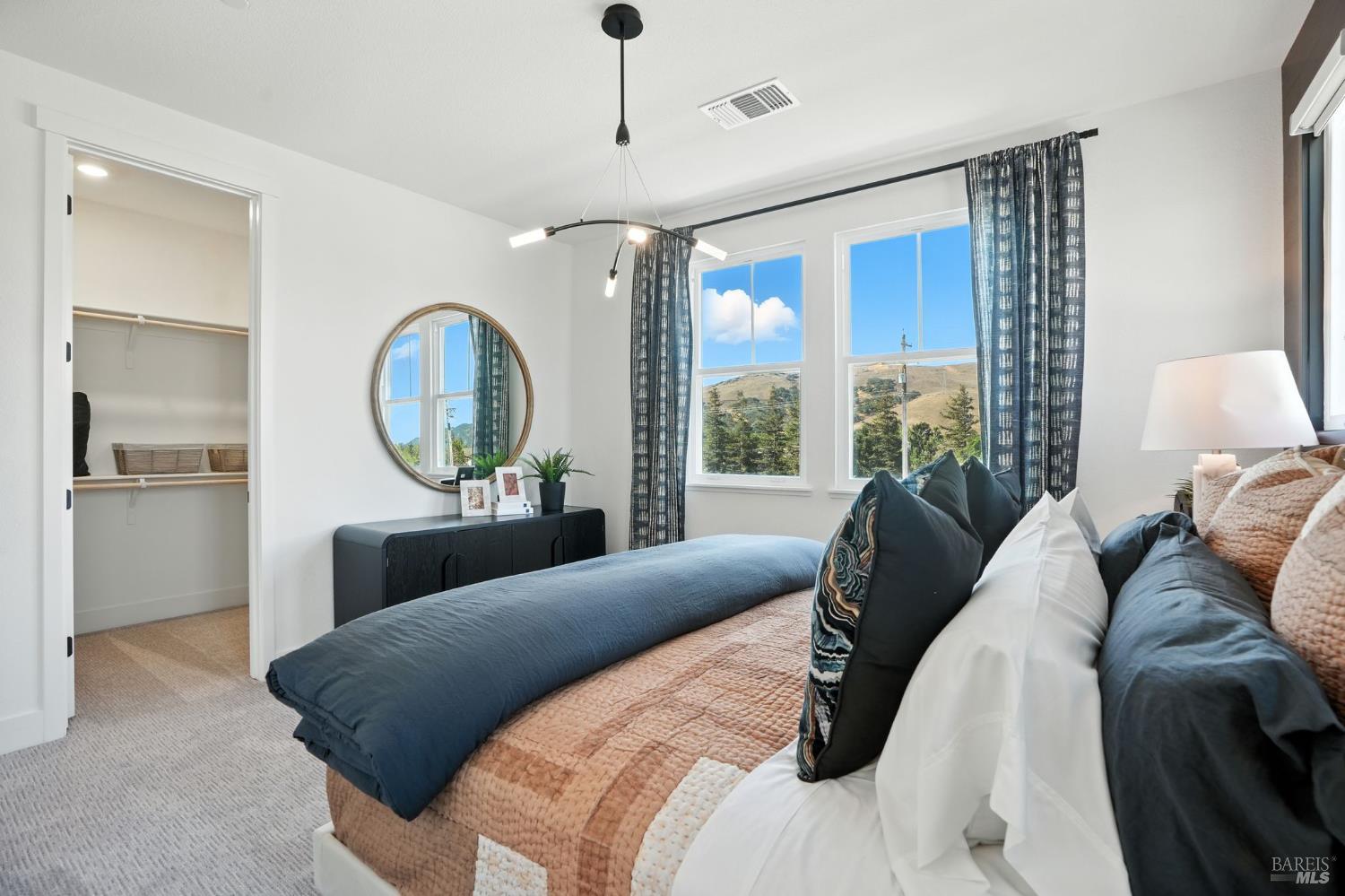 311 Hermes Common Livermore, CA 94551 - Photo 11 of 17 a bedroom with a large bed and a large window