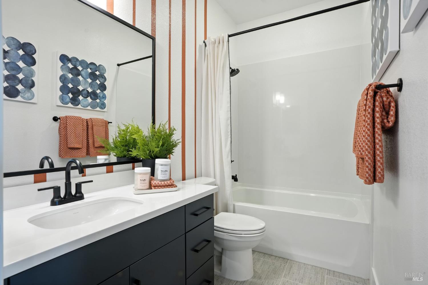 311 Hermes Common Livermore, CA 94551 - Photo 15 of 17 a bathroom with a sink a toilet and shower