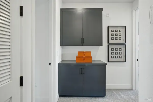 a view of a hallway with seating area