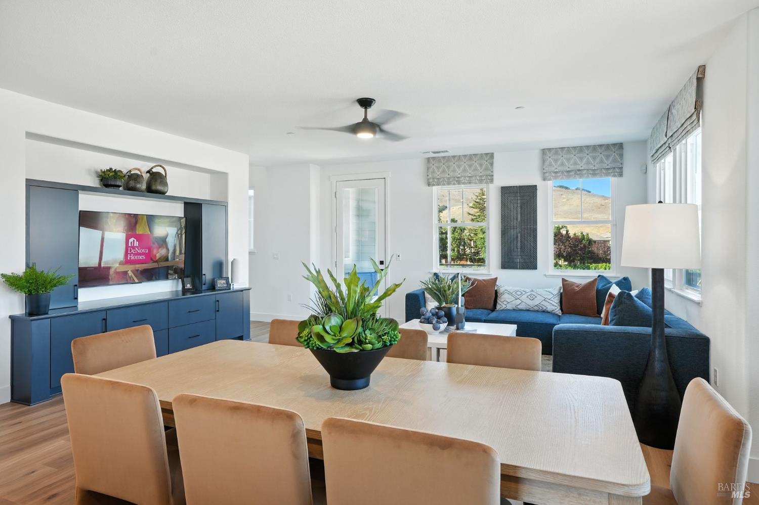 311 Hermes Common Livermore, CA 94551 - Photo 9 of 17 a living room with furniture a large window and a flat screen tv