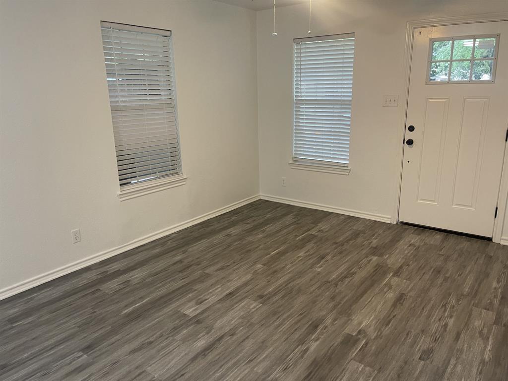 411 Smith Street Bonham, TX 75418 - Photo 13 of 22 Living room with view of front door
