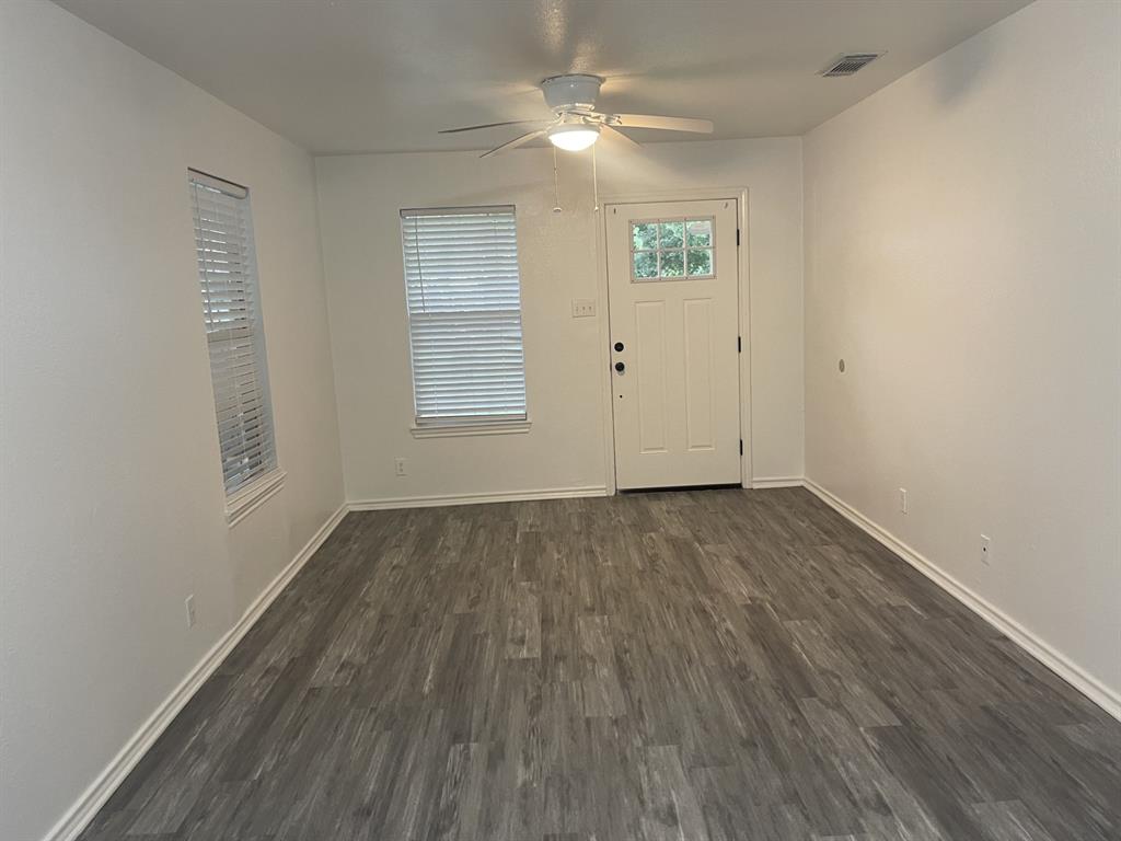 411 Smith Street Bonham, TX 75418 - Photo 14 of 22 Foyer entrance with ceiling fan