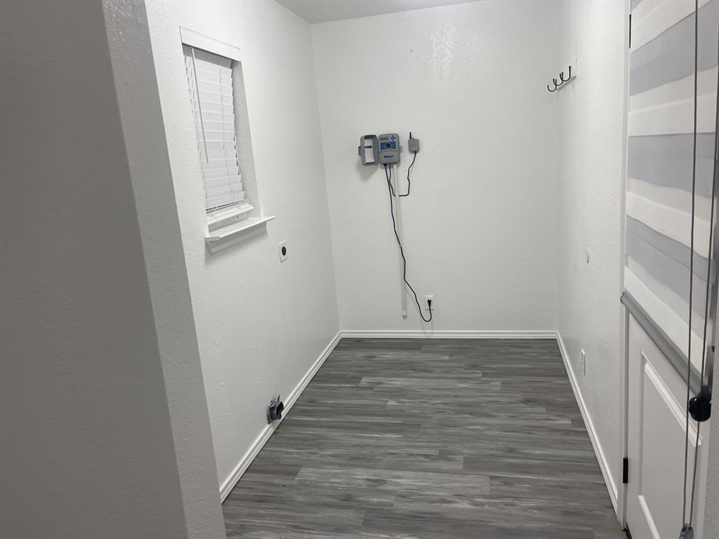 411 Smith Street Bonham, TX 75418 - Photo 17 of 22 Utility room with sprinkler system control box