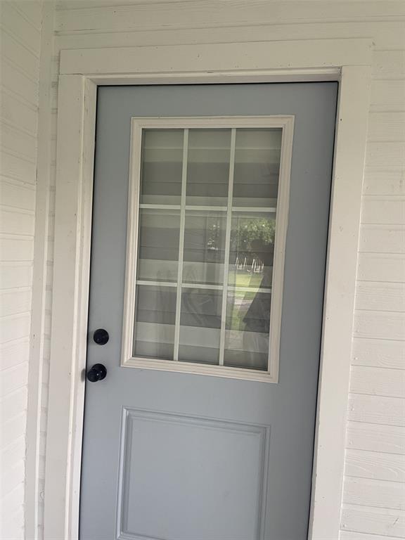 411 Smith Street Bonham, TX 75418 - Photo 22 of 22 Entrance to utility room from carport