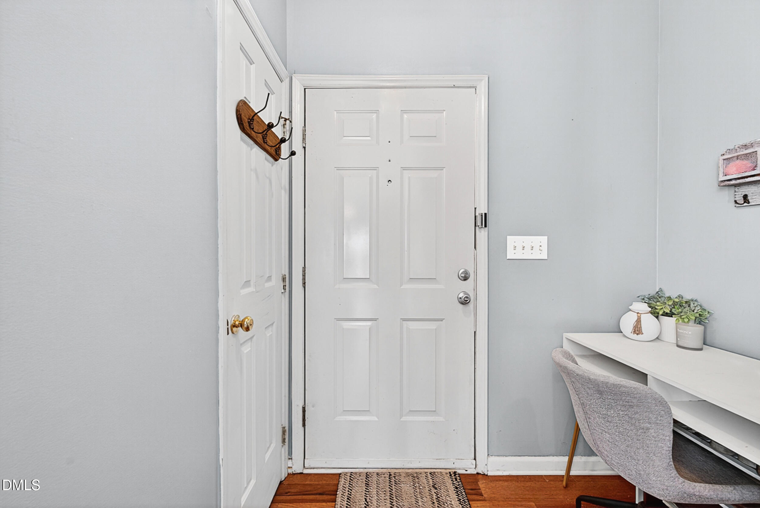 5351 Cog Hill Court Raleigh, NC 27604 - Photo 2 of 15 a view of an entryway with wooden floor