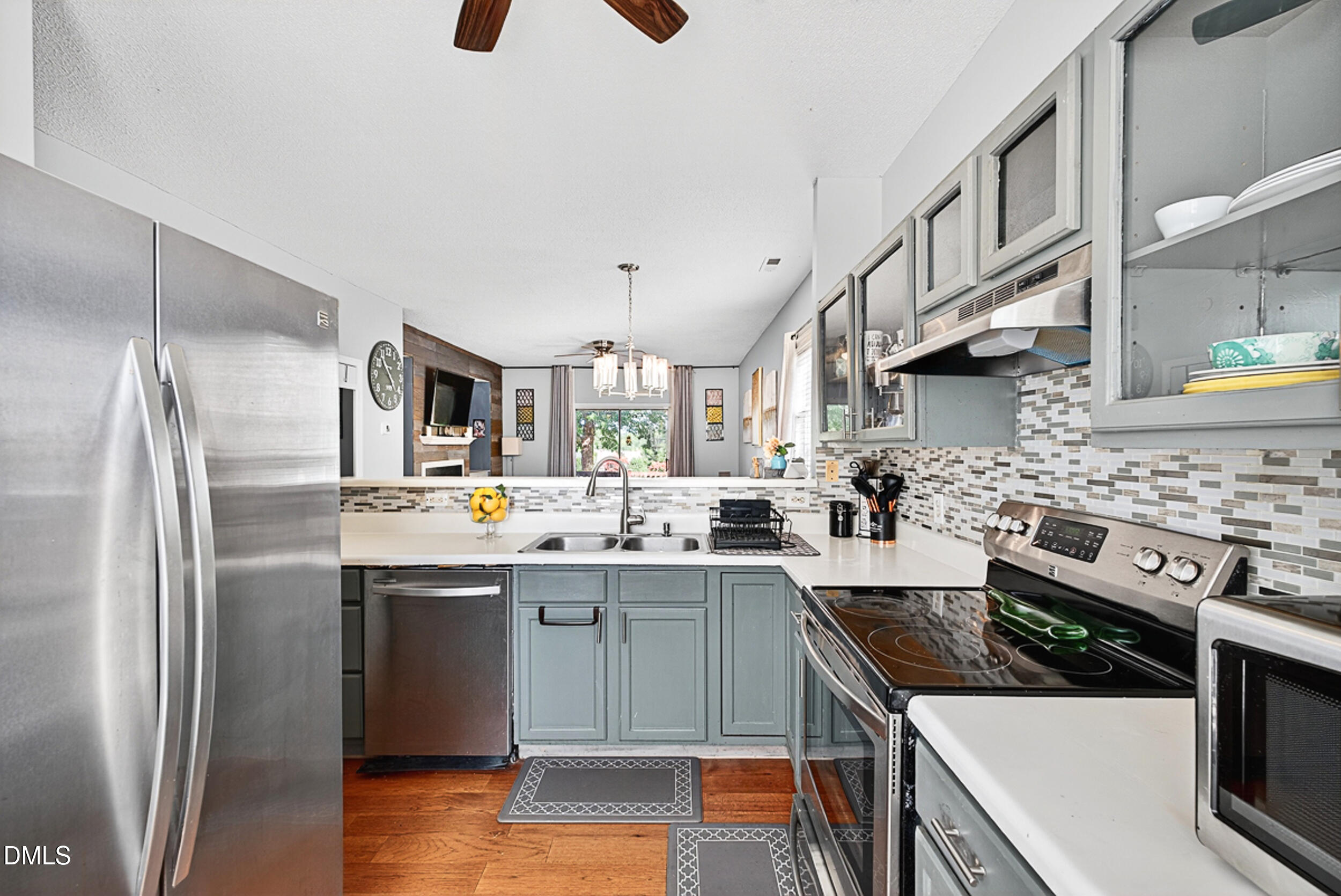 5351 Cog Hill Court Raleigh, NC 27604 - Photo 4 of 15 a kitchen with stainless steel appliances a sink stove and refrigerator
