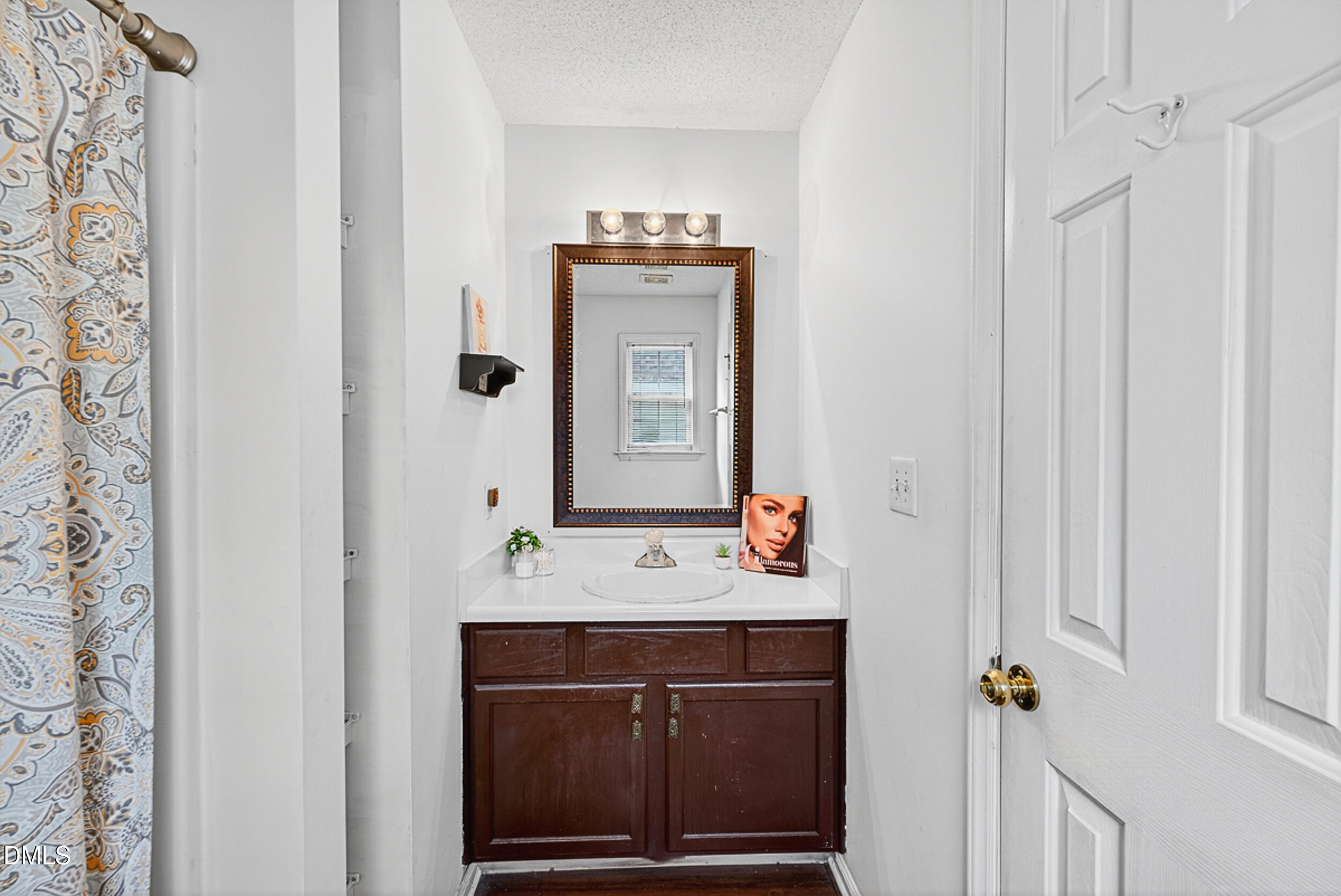 5351 Cog Hill Court Raleigh, NC 27604 - Photo 10 of 15 a bathroom with a sink and a mirror