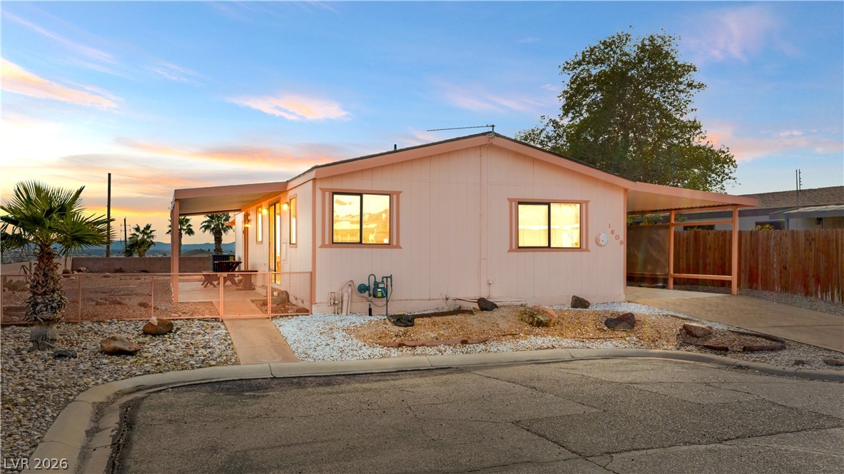 1609 Cajon Court Laughlin, NV 89029 - Photo 1 of 69 View of front of house featuring a fenced backyard and a patio