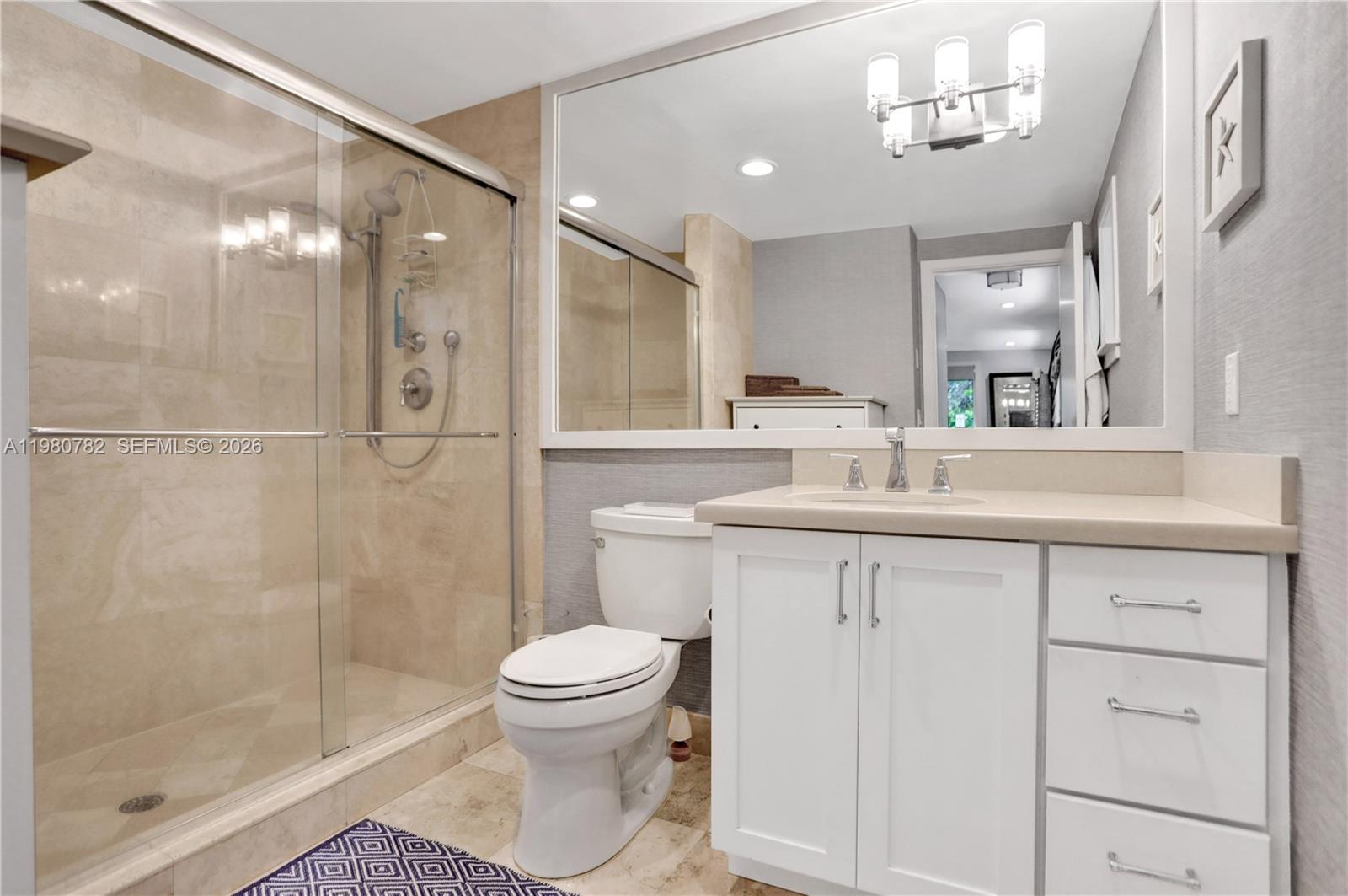 462 Glenridge Road Key Biscayne, FL 33149 - Photo 15 of 32 a bathroom with a sink a toilet and shower