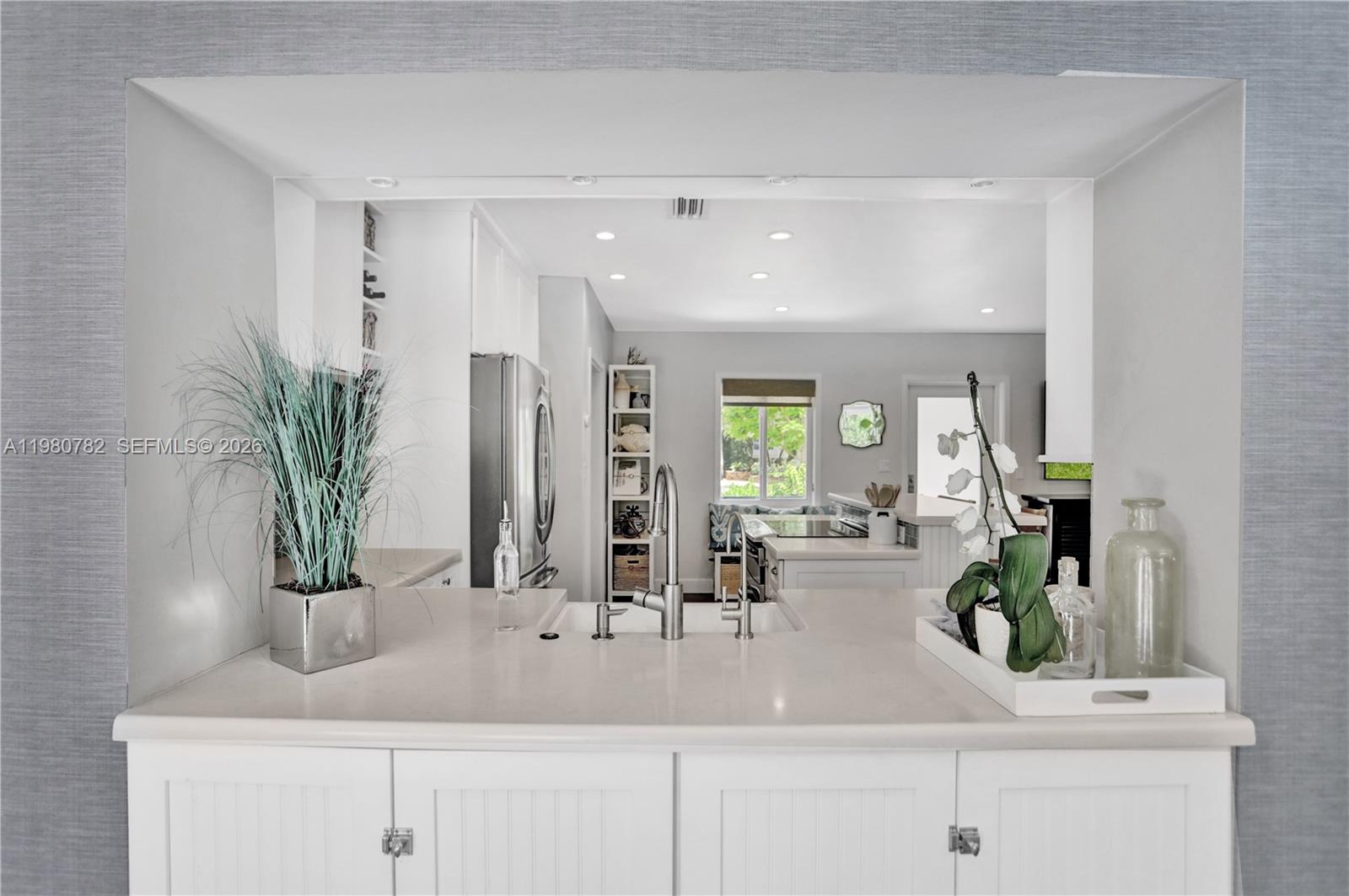 462 Glenridge Road Key Biscayne, FL 33149 - Photo 16 of 32 a bathroom with sink and mirror