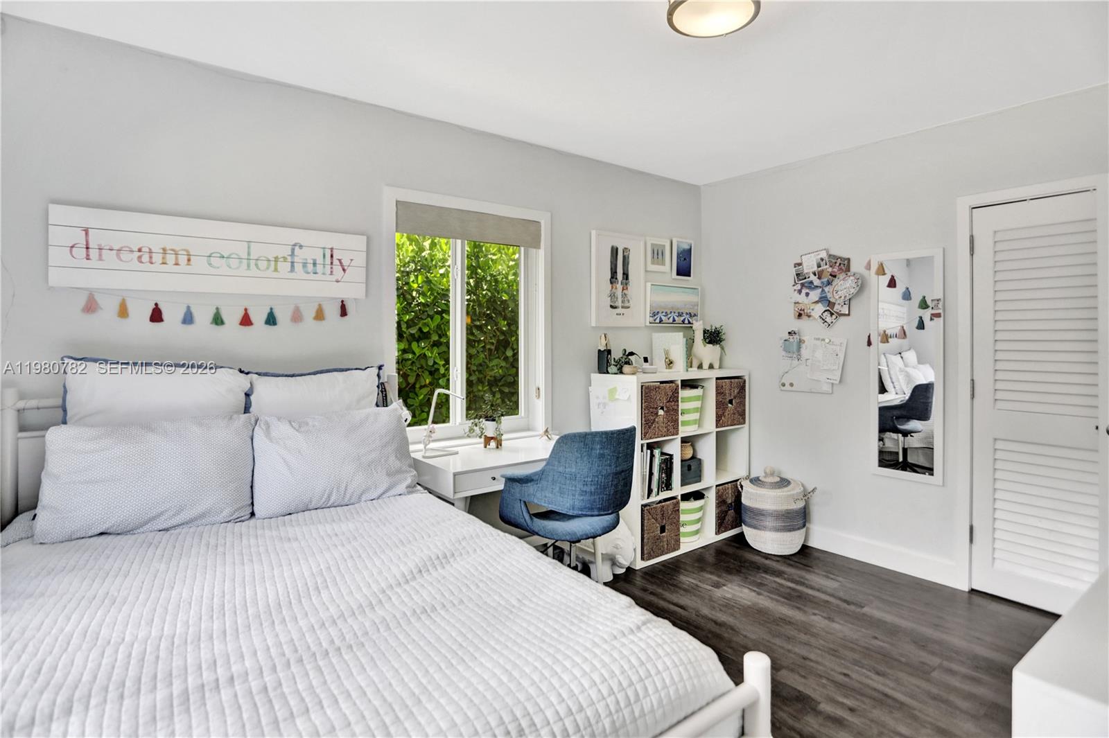 462 Glenridge Road Key Biscayne, FL 33149 - Photo 20 of 32 a bedroom with a bed and a large window