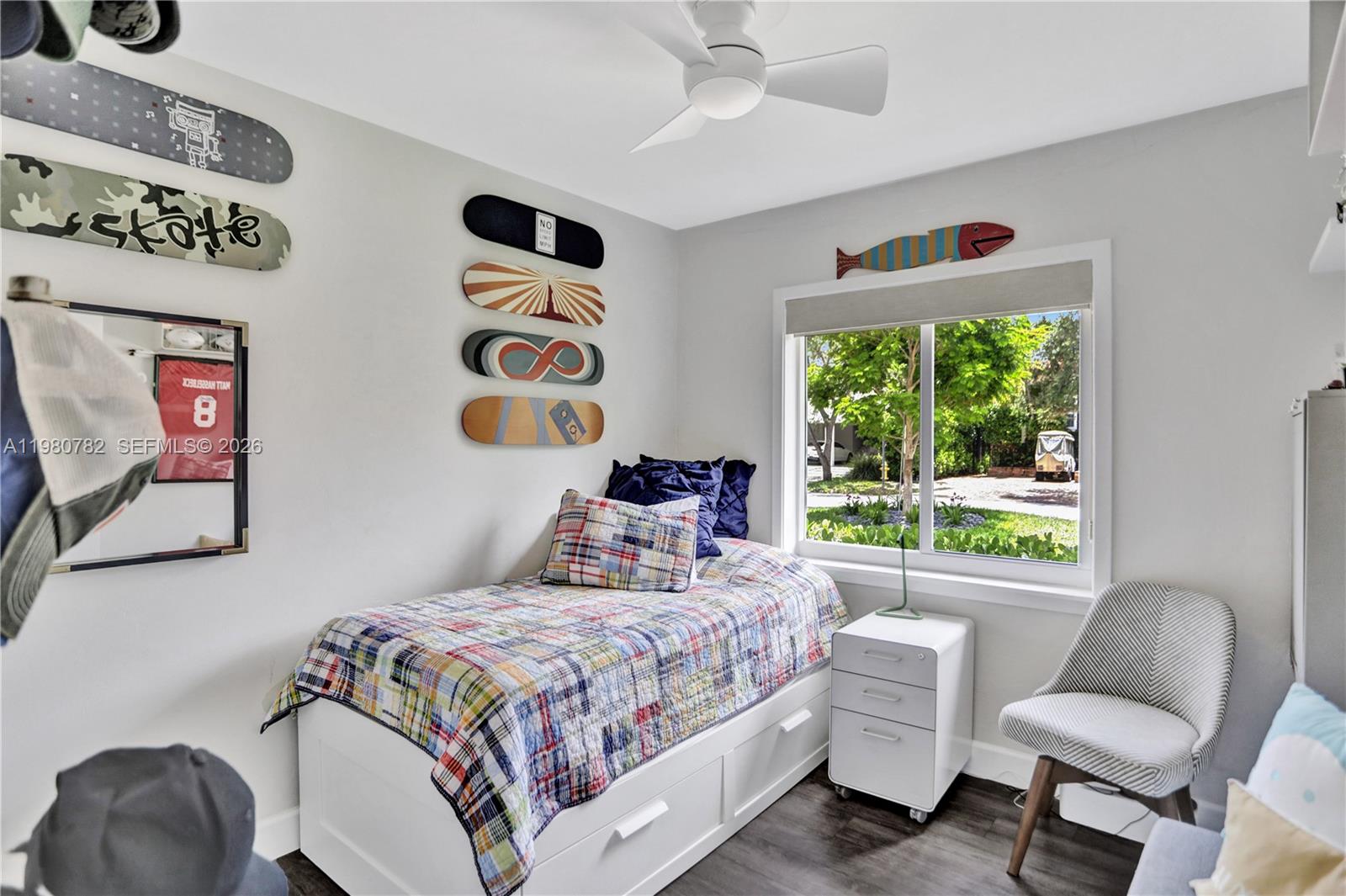 462 Glenridge Road Key Biscayne, FL 33149 - Photo 21 of 32 a bedroom with a bed and a chair with the outer view