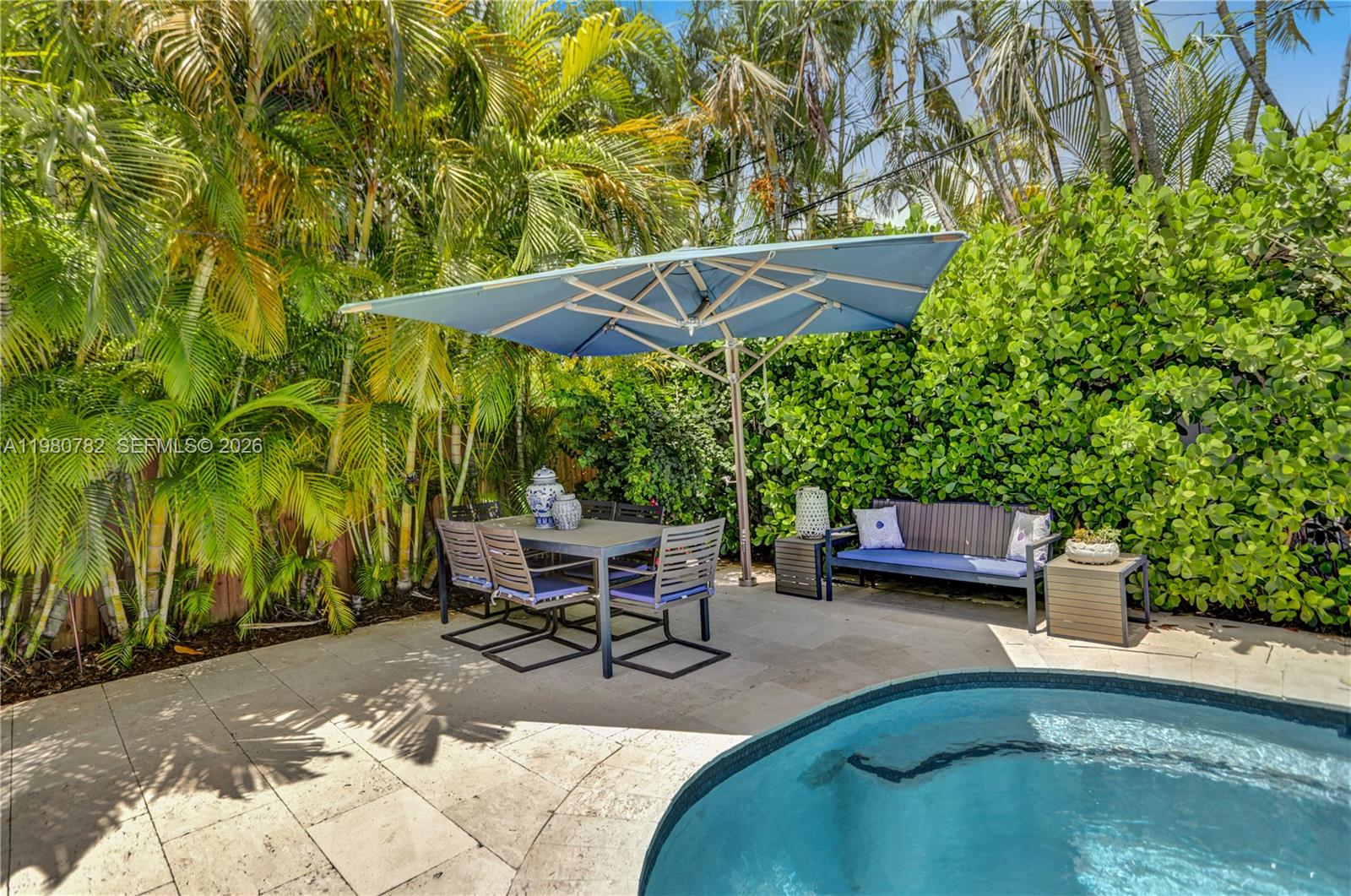 462 Glenridge Road Key Biscayne, FL 33149 - Photo 25 of 32 a view of backyard with outdoor seating and trees