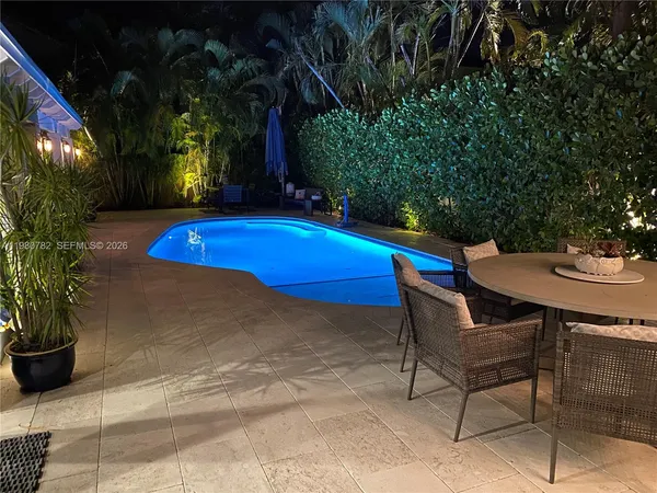 a view of a chairs and table in the patio