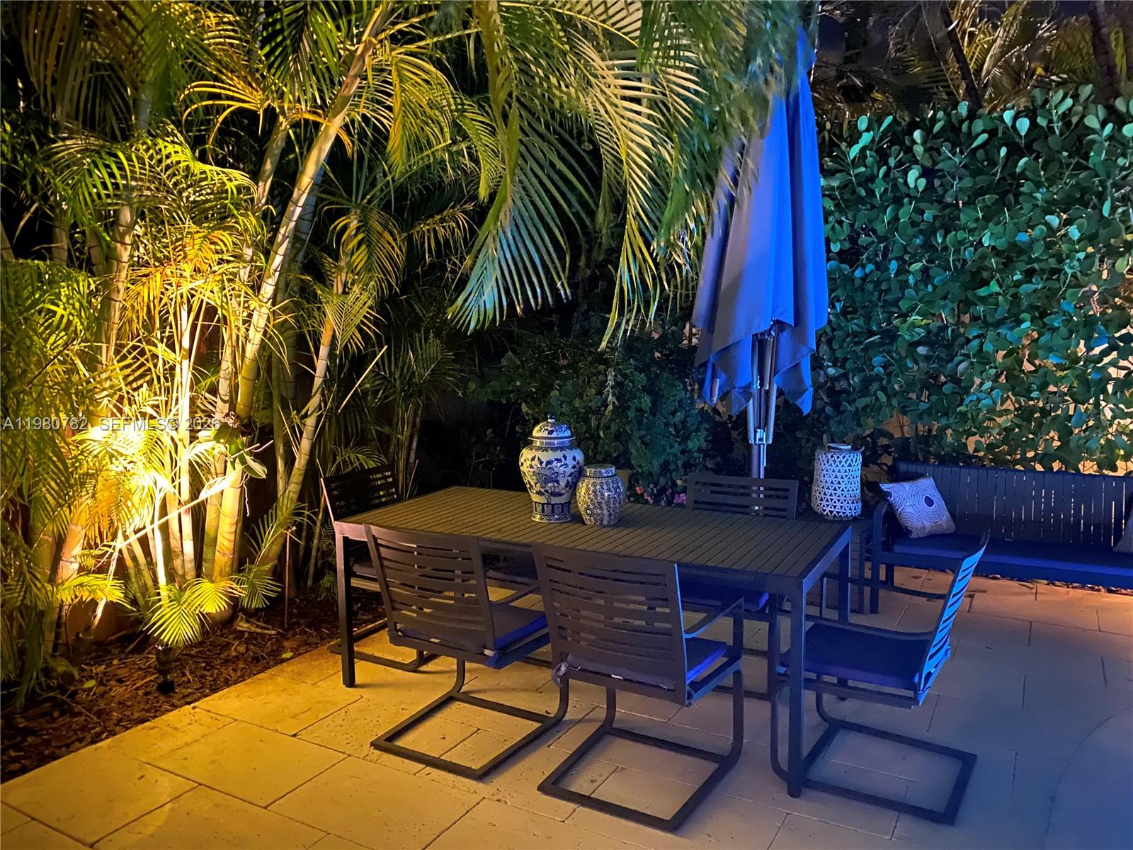 462 Glenridge Road Key Biscayne, FL 33149 - Photo 31 of 32 a view of a chairs and table in patio