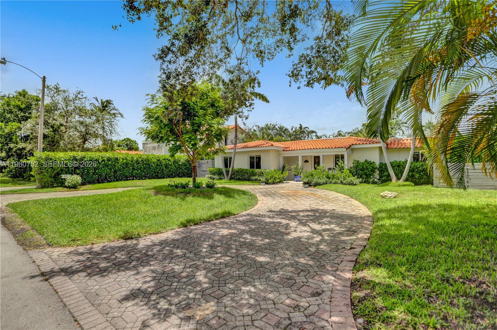 462 Glenridge Road Key Biscayne, FL 33149 - Photo 32 of 32 a view of a house with a yard
