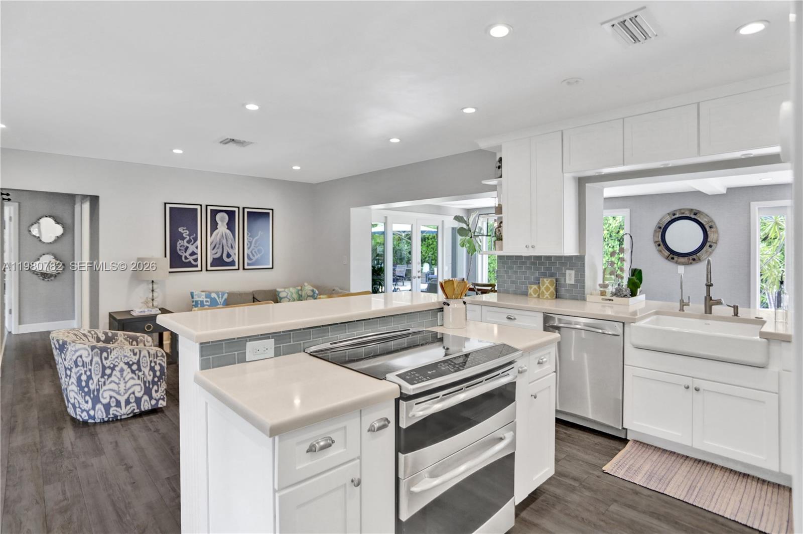 462 Glenridge Road Key Biscayne, FL 33149 - Photo 7 of 32 a living room with furniture and a large window