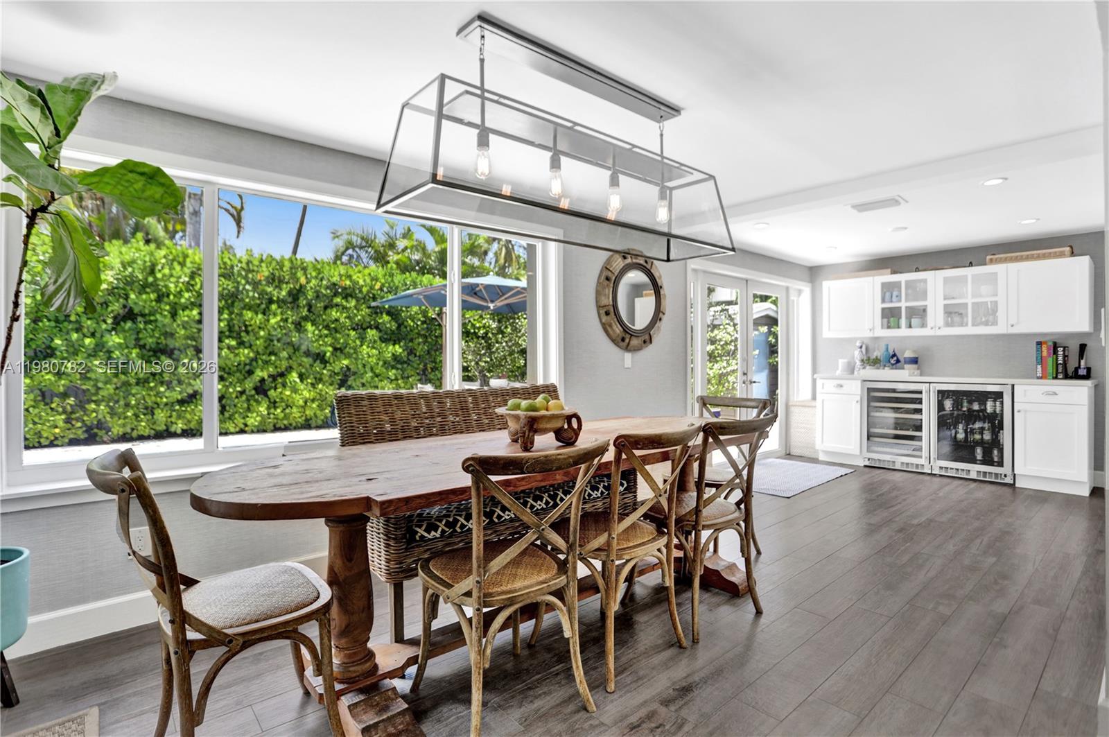 462 Glenridge Road Key Biscayne, FL 33149 - Photo 8 of 32 a view of a dining table and chairs in a room
