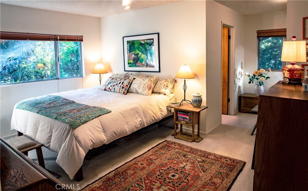 2700 Mill Creek Road Mentone, CA 92359 - Photo 6 of 22 a bedroom with a bed and window