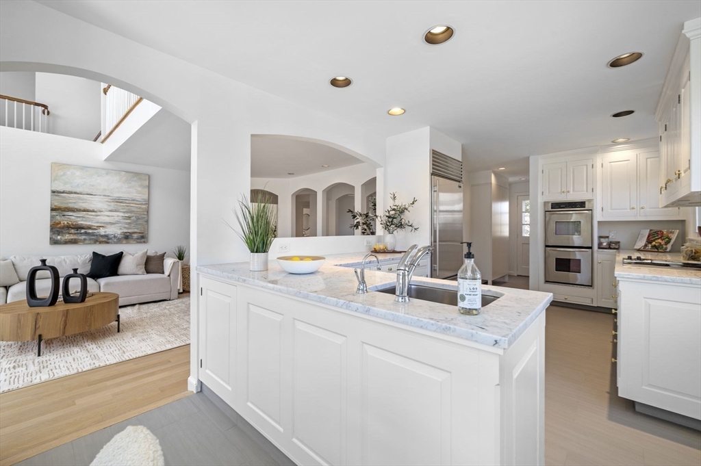 10 Rolleston Road Marblehead, MA 01945 - Photo 15 of 42 a living room with stainless steel appliances kitchen island granite countertop furniture and a view of kitchen