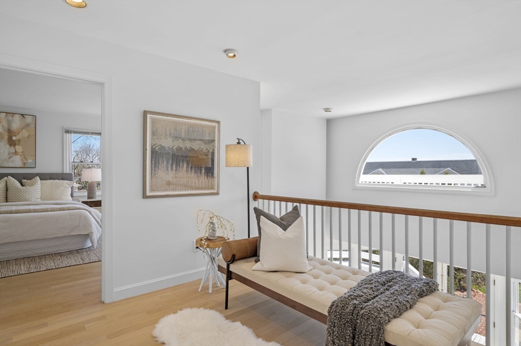 10 Rolleston Road Marblehead, MA 01945 - Photo 20 of 42 a bedroom with a bed and a chandelier