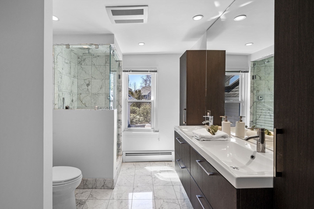 10 Rolleston Road Marblehead, MA 01945 - Photo 24 of 42 a bathroom with a double vanity sink toilet and shower