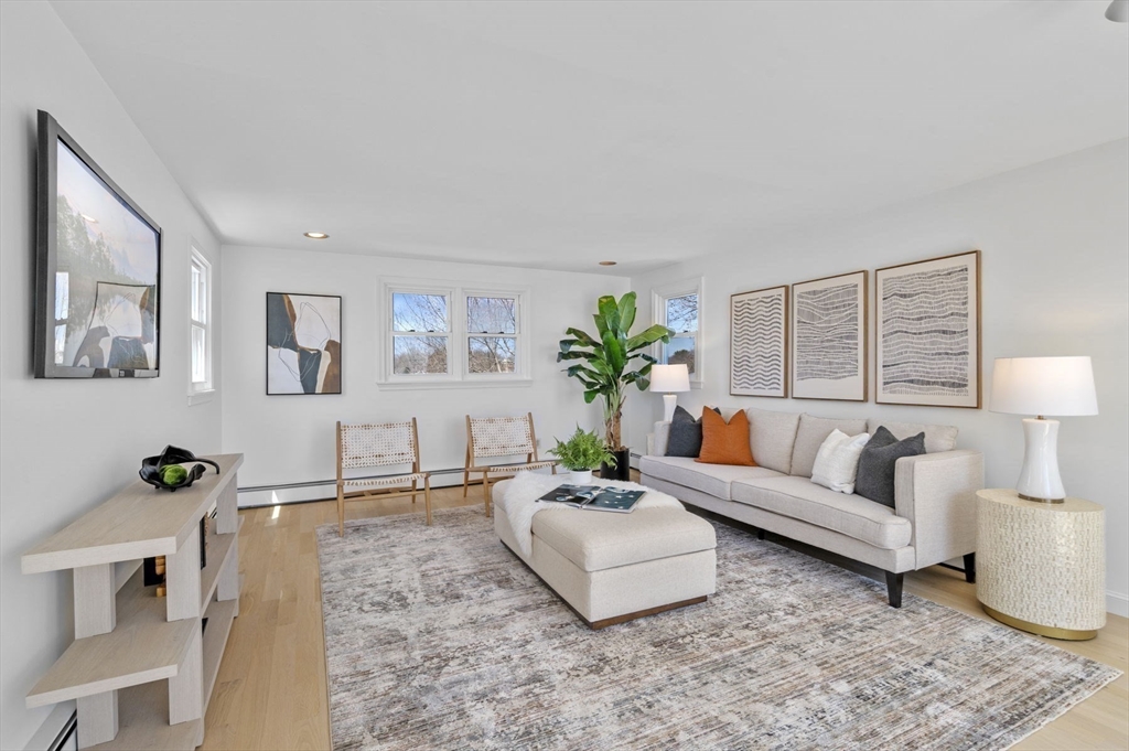 10 Rolleston Road Marblehead, MA 01945 - Photo 30 of 42 a living room with furniture and a potted plant on the wall
