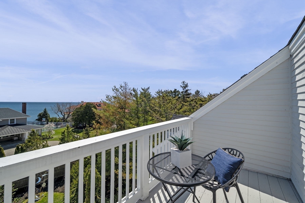 10 Rolleston Road Marblehead, MA 01945 - Photo 32 of 42 a balcony with table and chairs