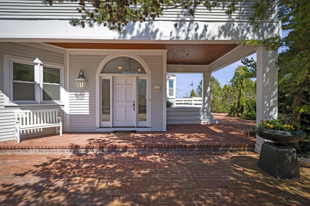 10 Rolleston Road Marblehead, MA 01945 - Photo 4 of 42 a view of a house with a small yard and wooden floor and fence