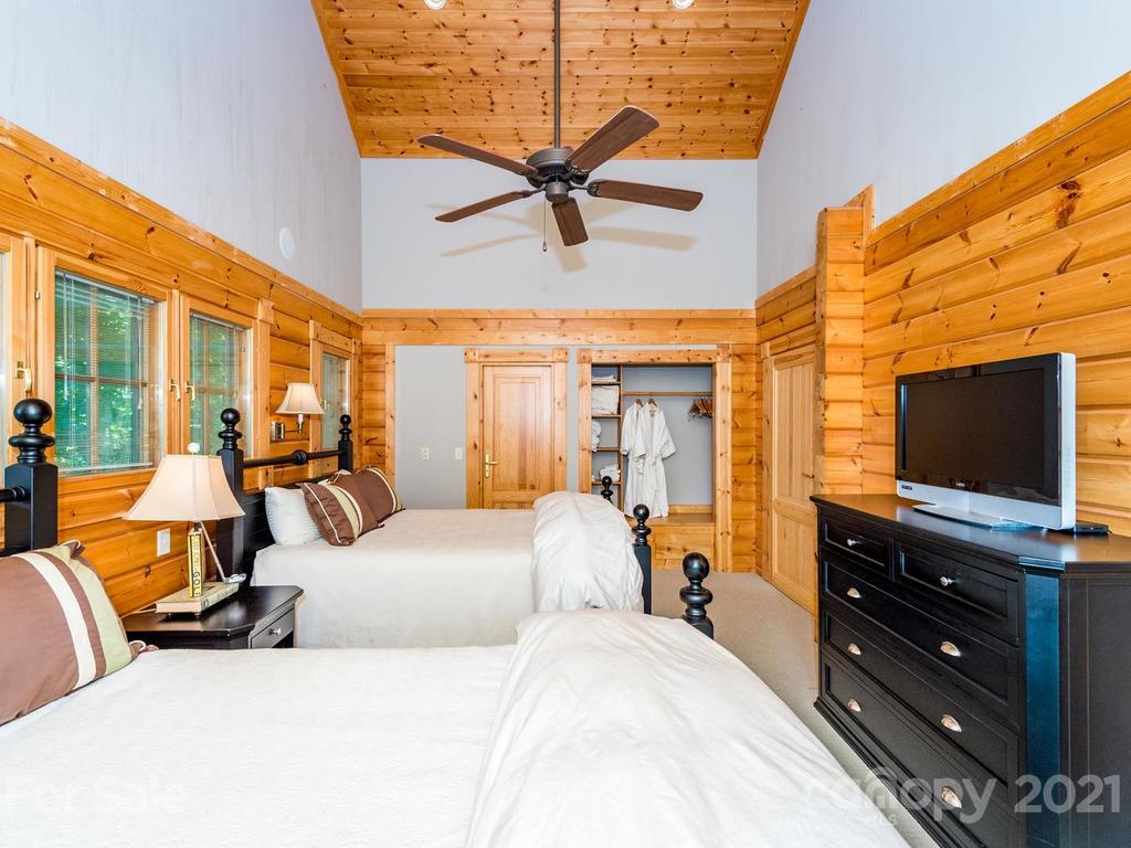 429 West Gate Road, Unit 24 Sylva, NC 28779 - Photo 22 of 35 a bedroom with furniture and a flat screen tv