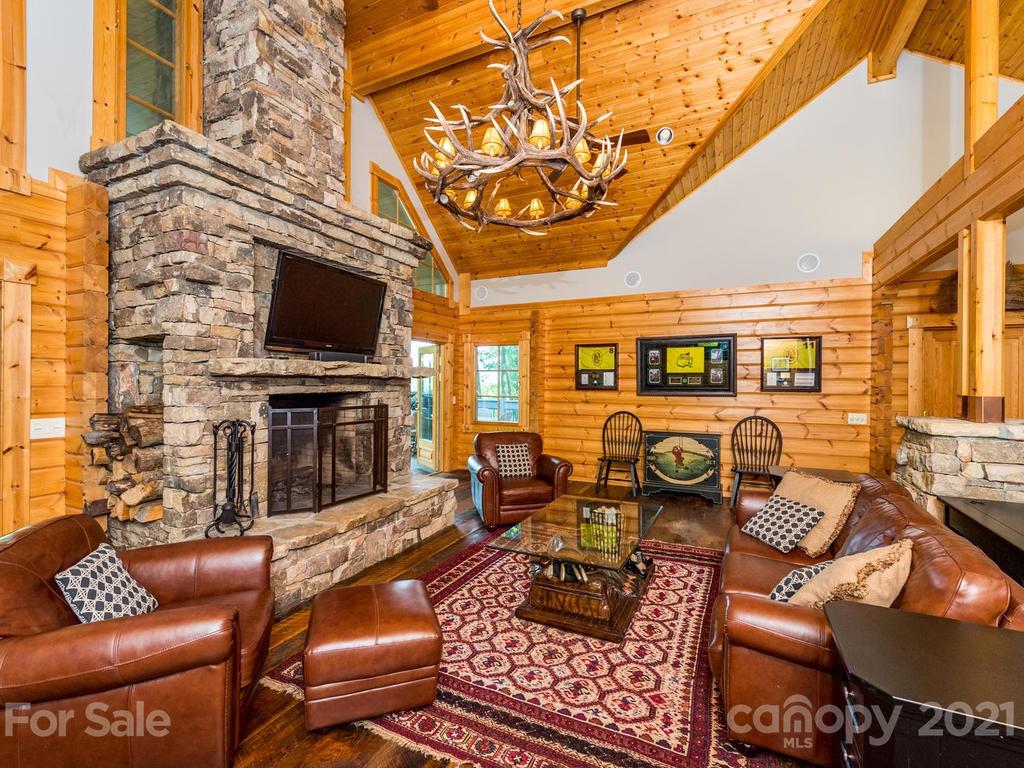 429 West Gate Road, Unit 24 Sylva, NC 28779 - Photo 8 of 35 a outdoor living space with furniture and a flat screen tv
