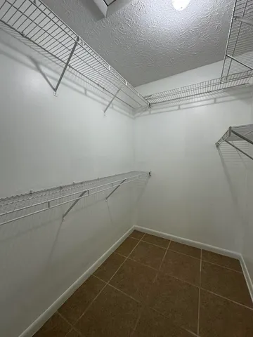 a view of a room with racks on the wall