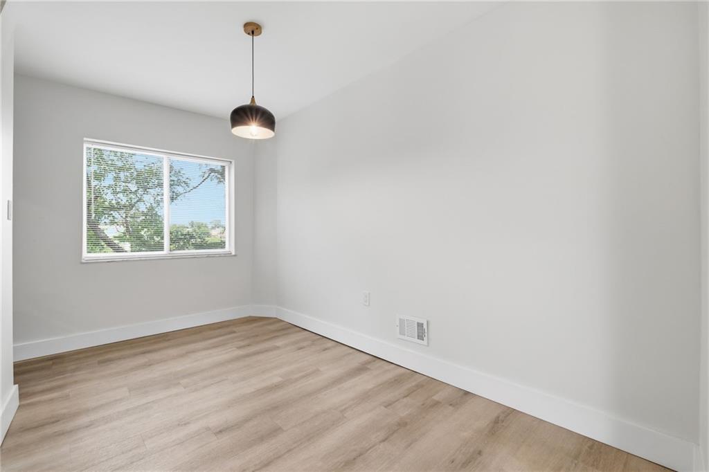 2961 Ruthwood Avenue Pittsburgh, PA 15227 - Photo 8 of 29 an empty room with wooden floor and windows